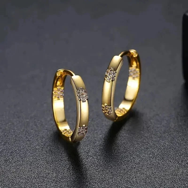 Vintage hoop earrings in the shape of a circle with golden flower